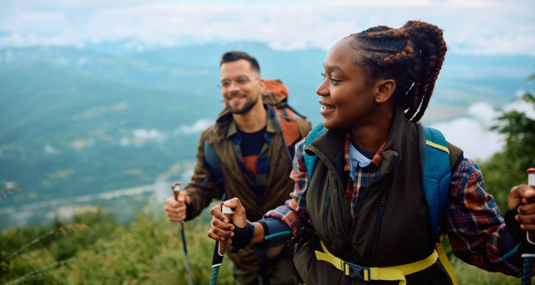 2 people hiking together