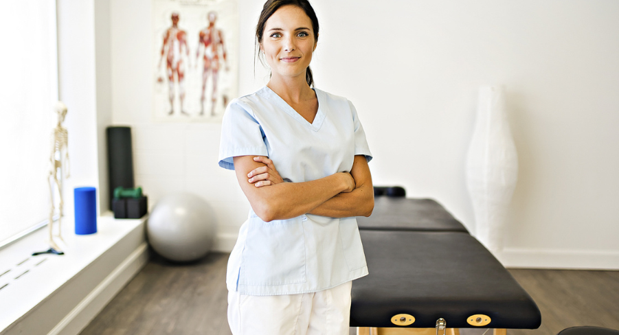 Physical therapist with her arms crossed looking at the camera