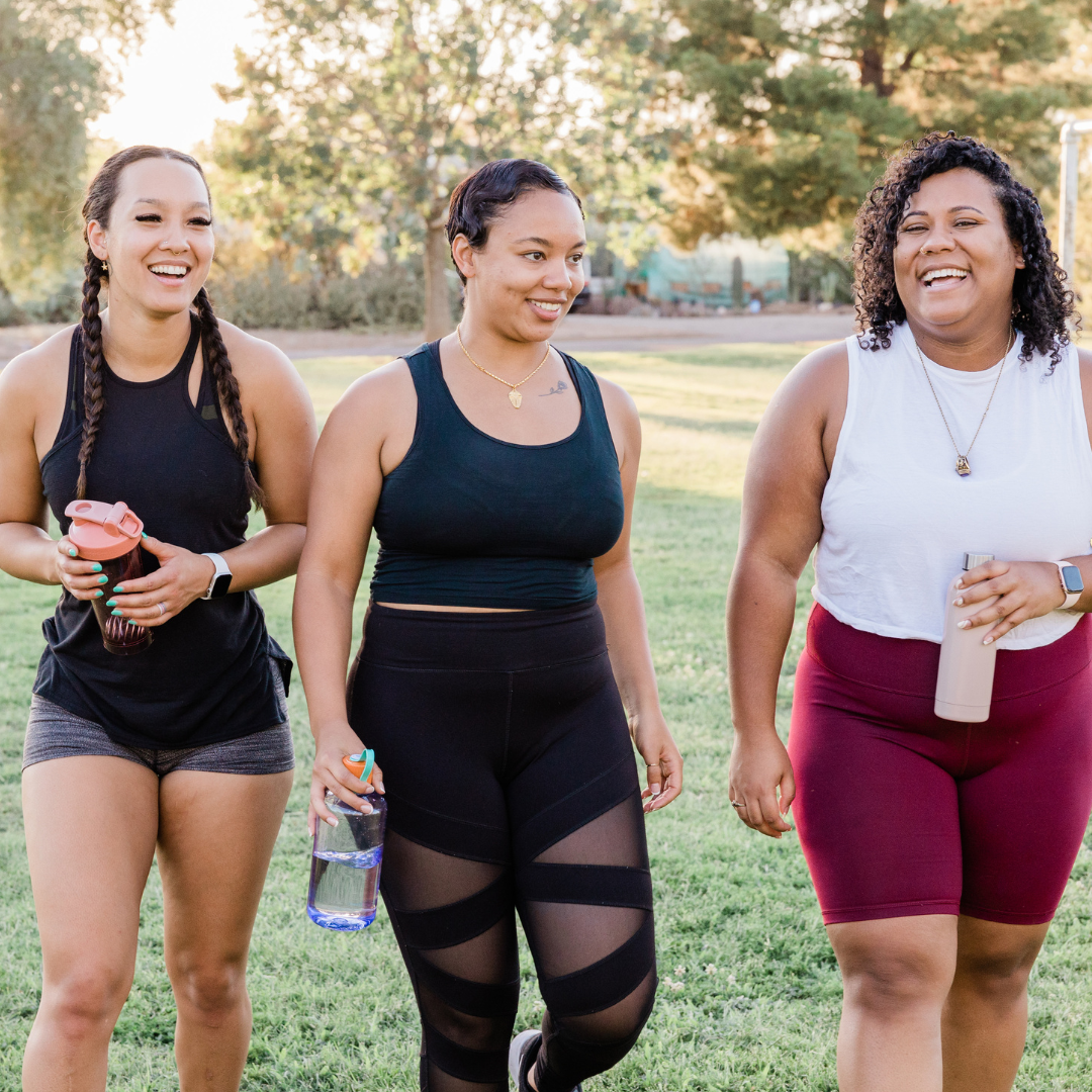 3 friends in workout clothes walking together