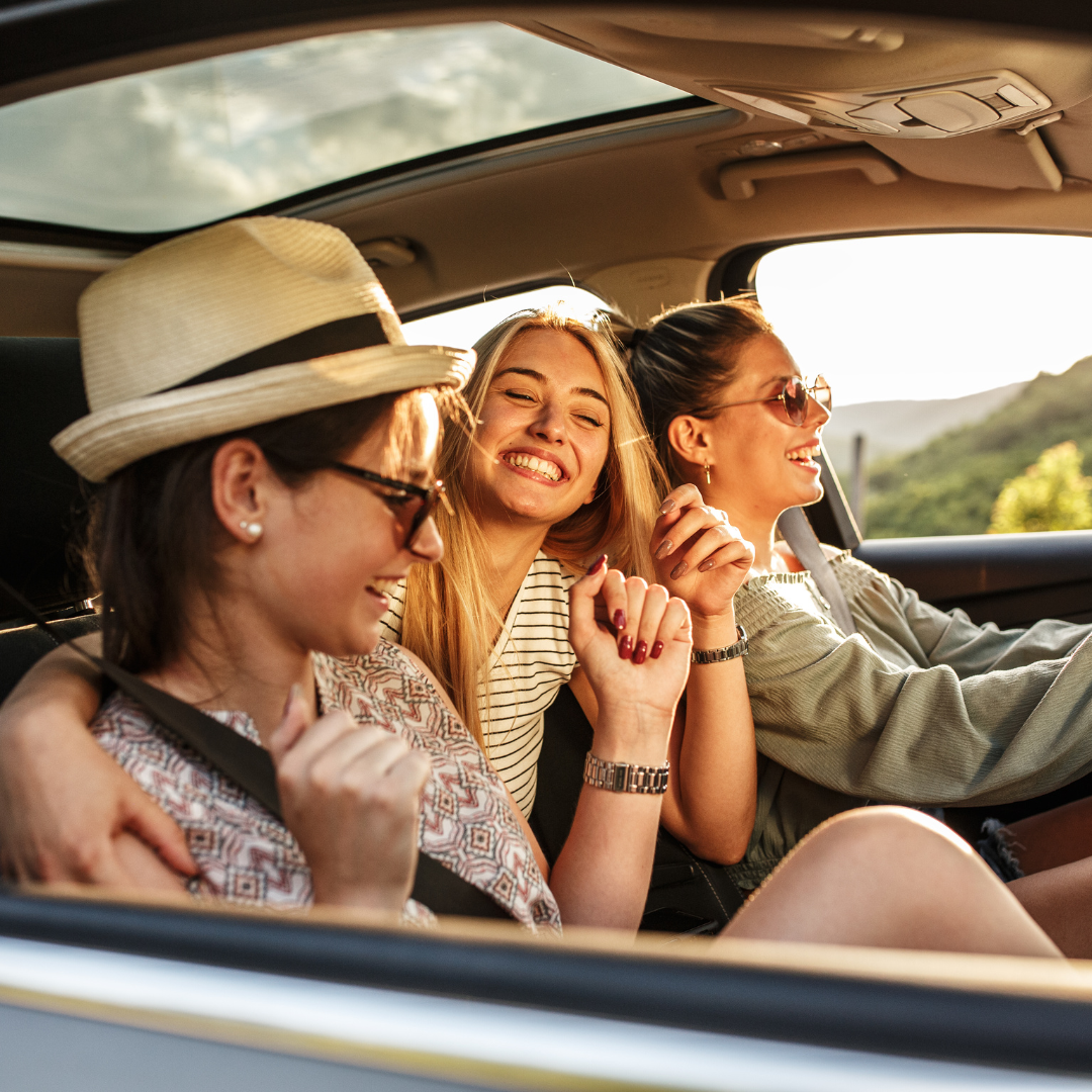 3 healthcare travelers driving in a car together