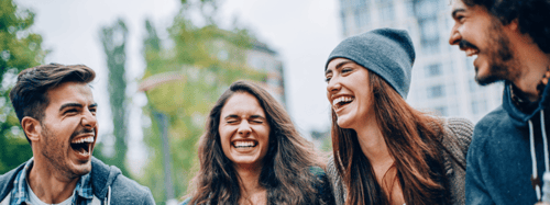 4 friends laughing together