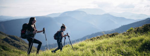 2 people hiking in the mountains