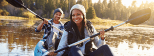 Couple rowing on a canoe together