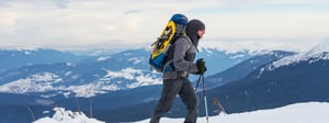 Man hiking through a snowy mountain