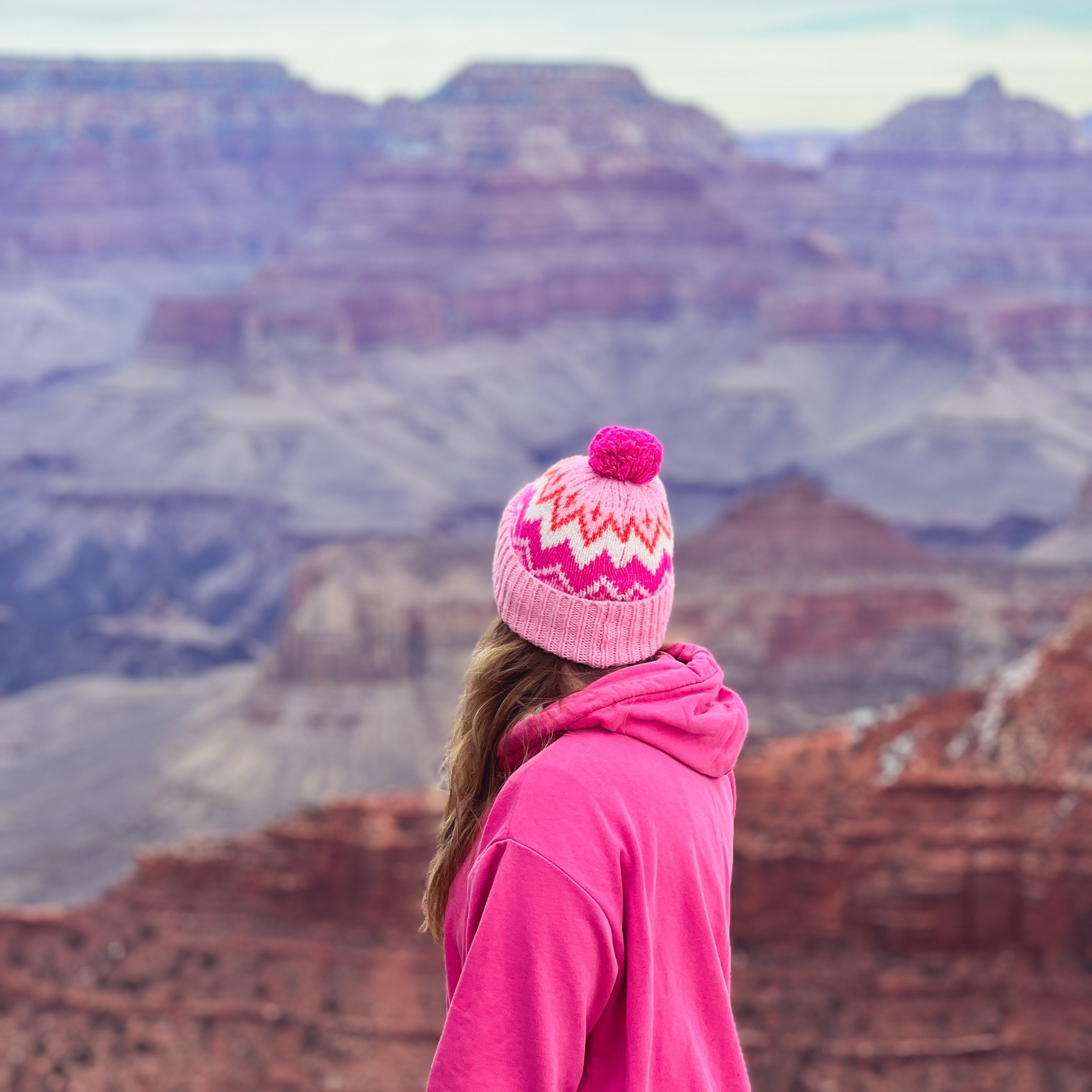 Women standing in a canyon looking into the distance