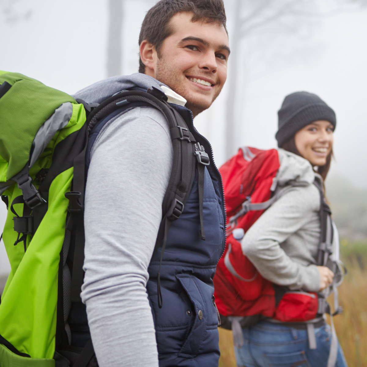 Couple back packing and smiling