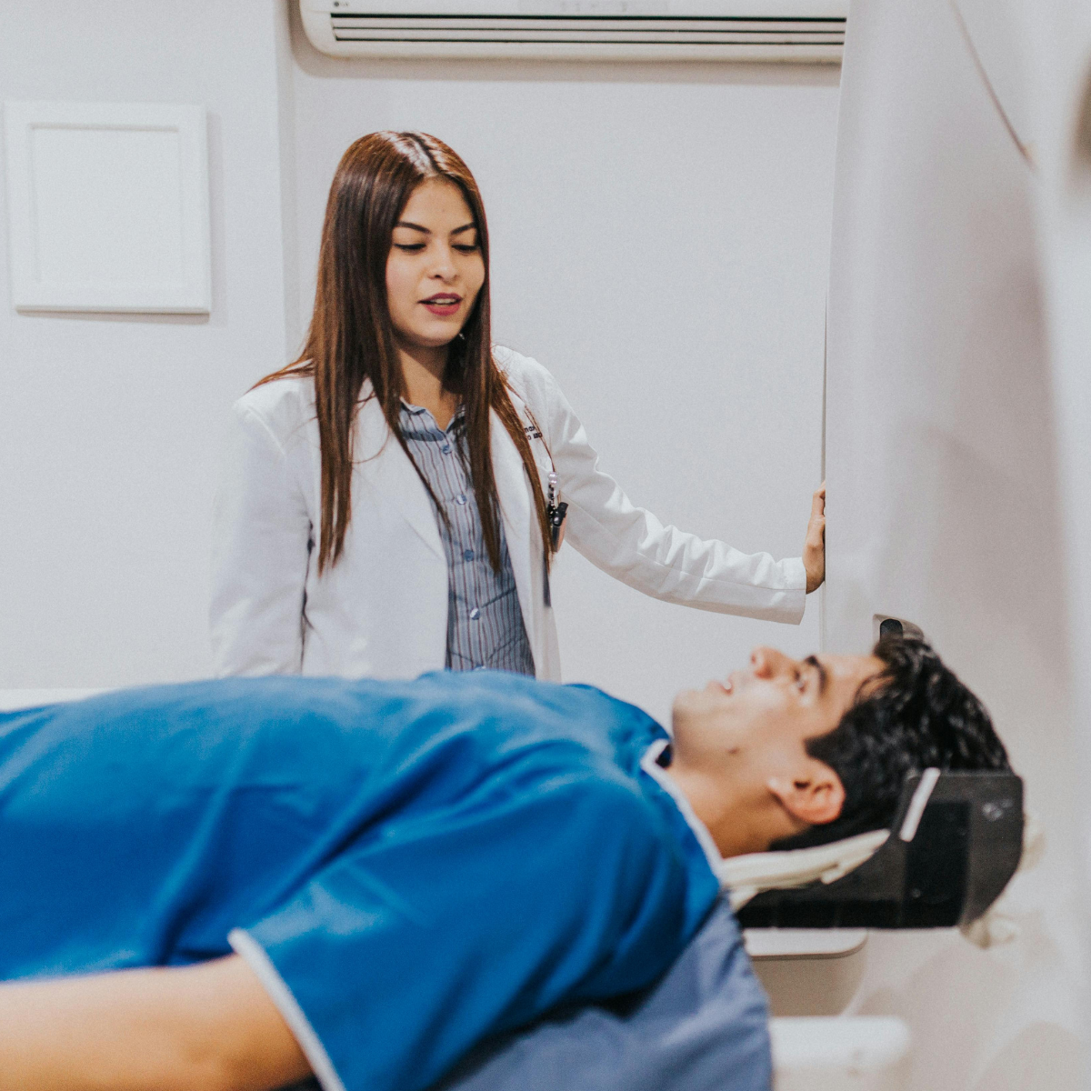 MRI tech scanning a patient