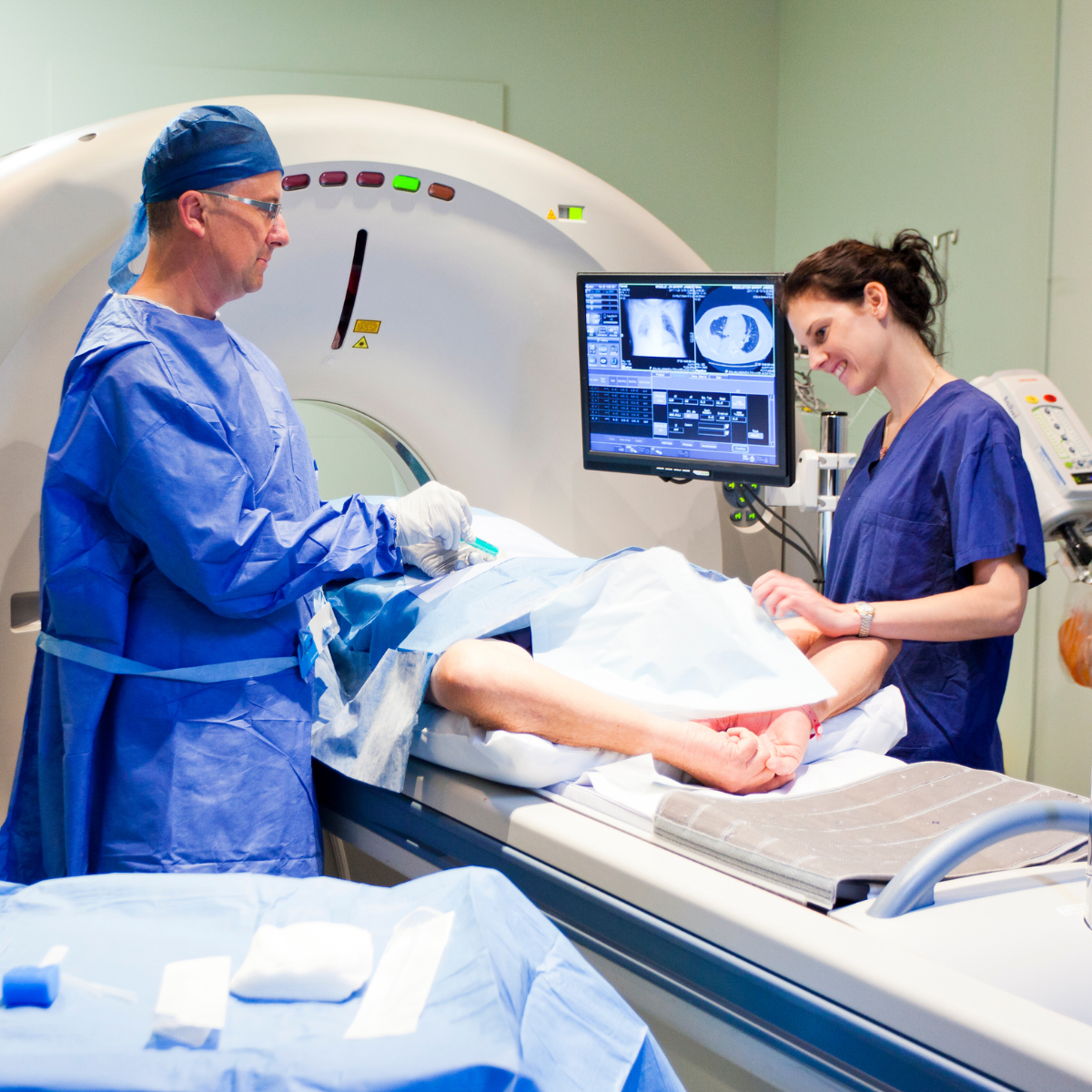 MRI tech working with a patient