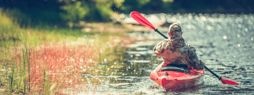 Man kayaking on a lake
