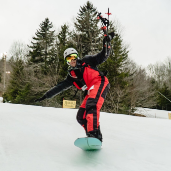Person standing on a snowboard 338 x 338