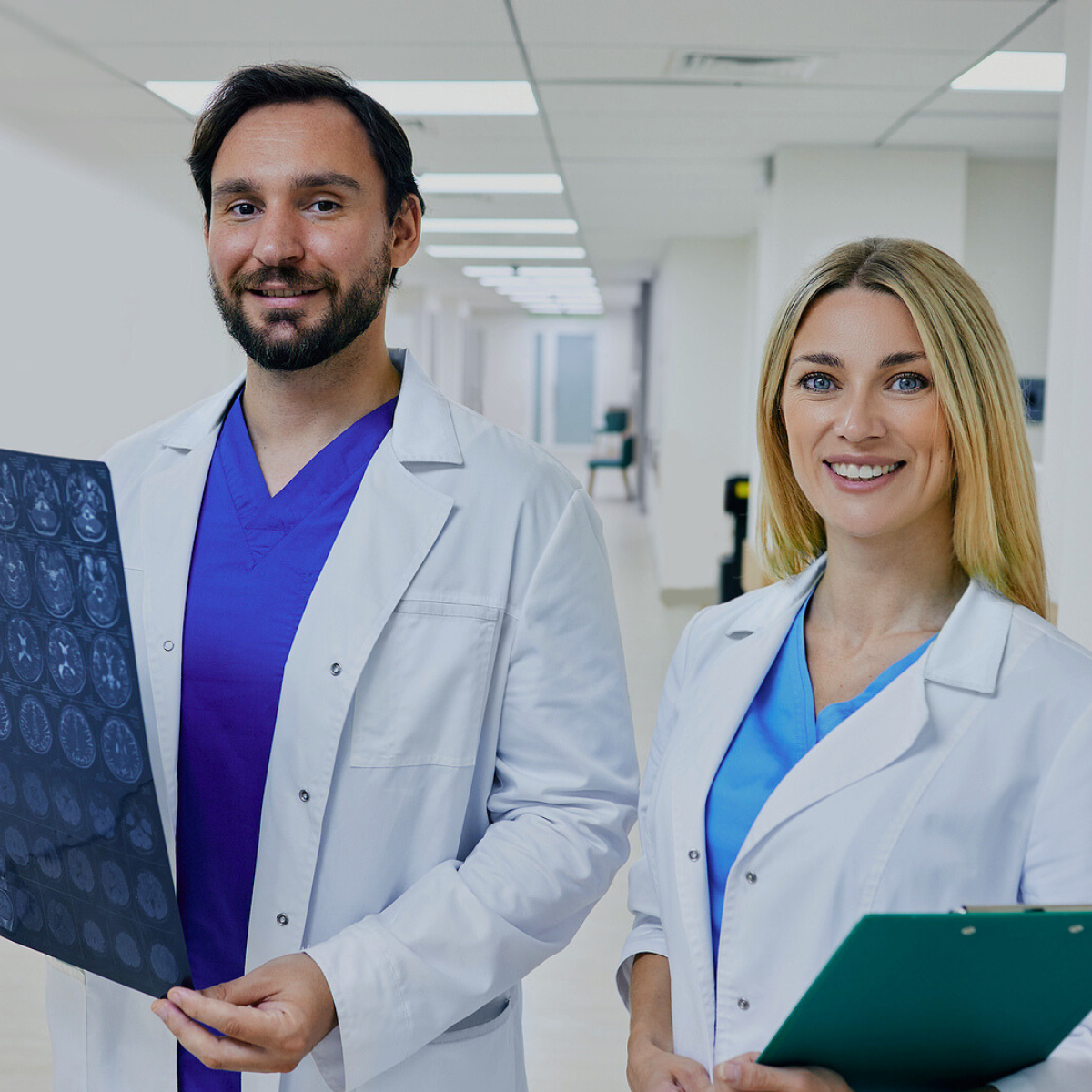 Radiologists smiling and holding documentation