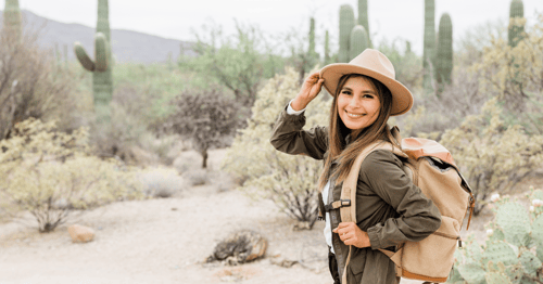Woman wearing a hat in a desert
