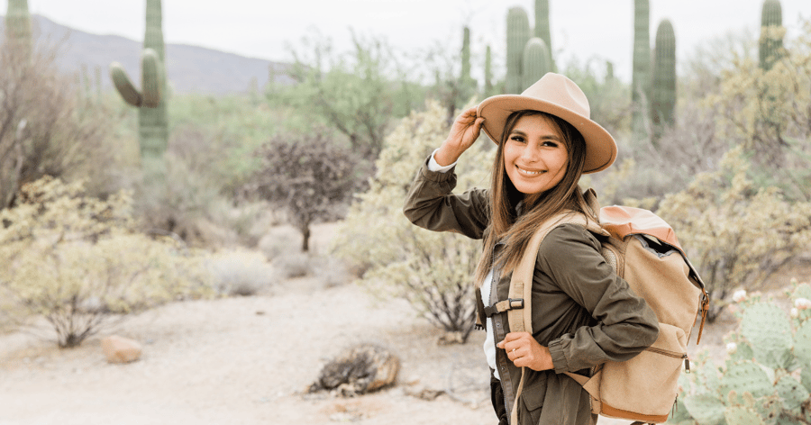 Woman wearing a hat in a desert