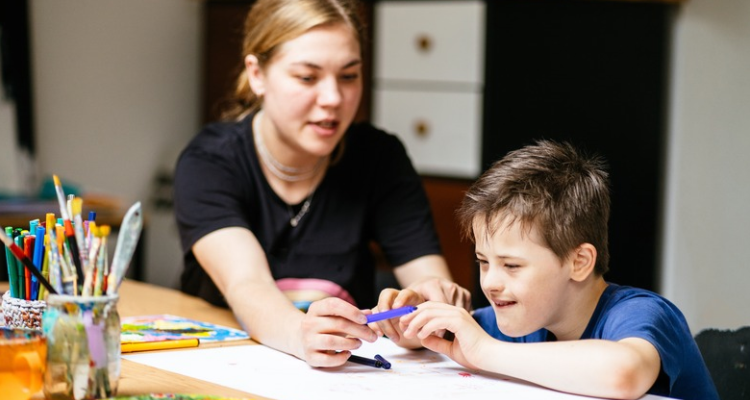 Special education teacher helping a student