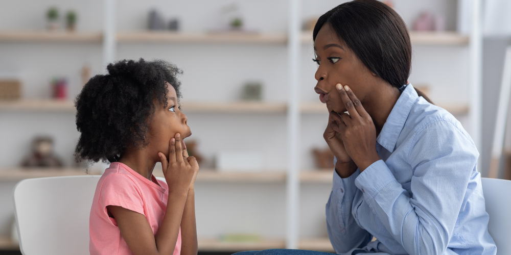 Speech language pathologist working with a student-2
