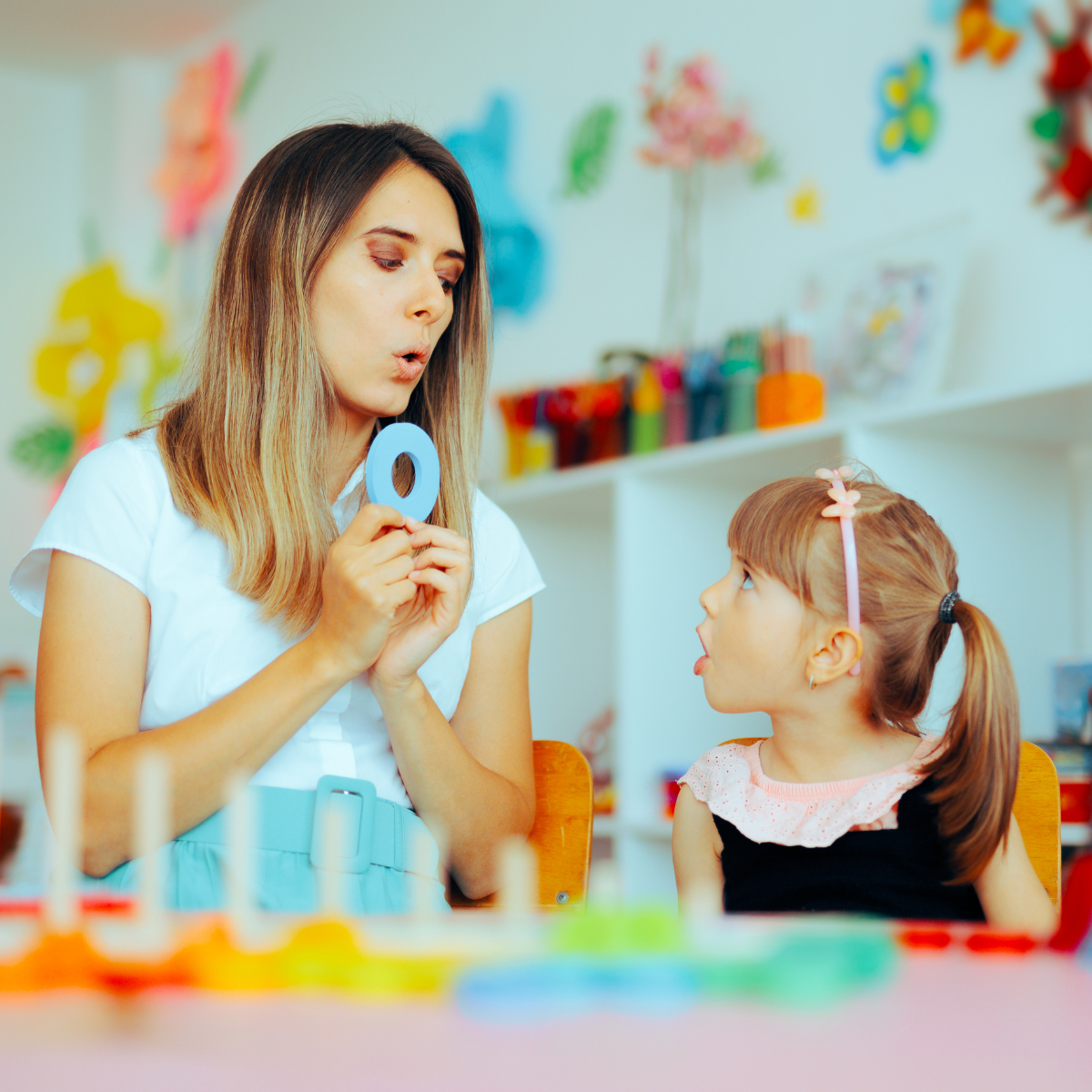 Speech language pathologist working with a student