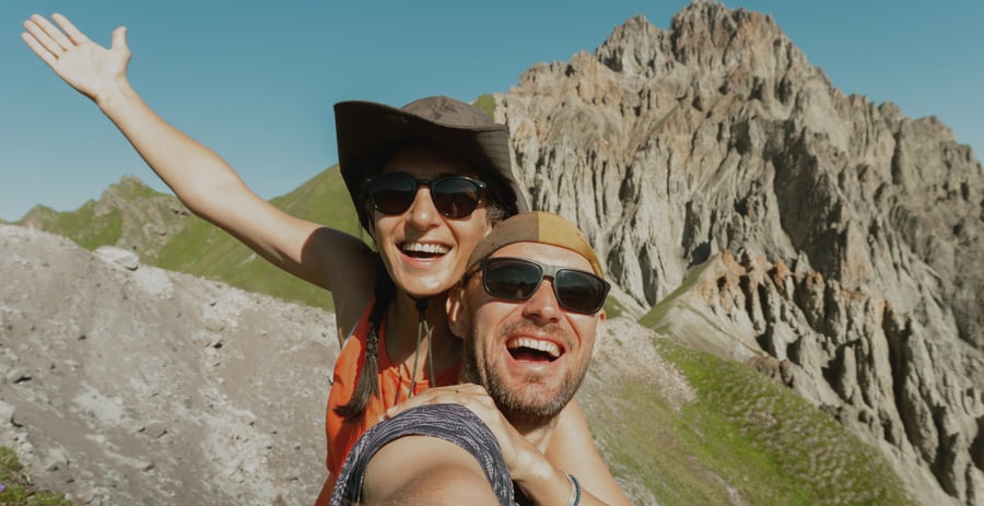 Couple taking a selfie in a mountain range