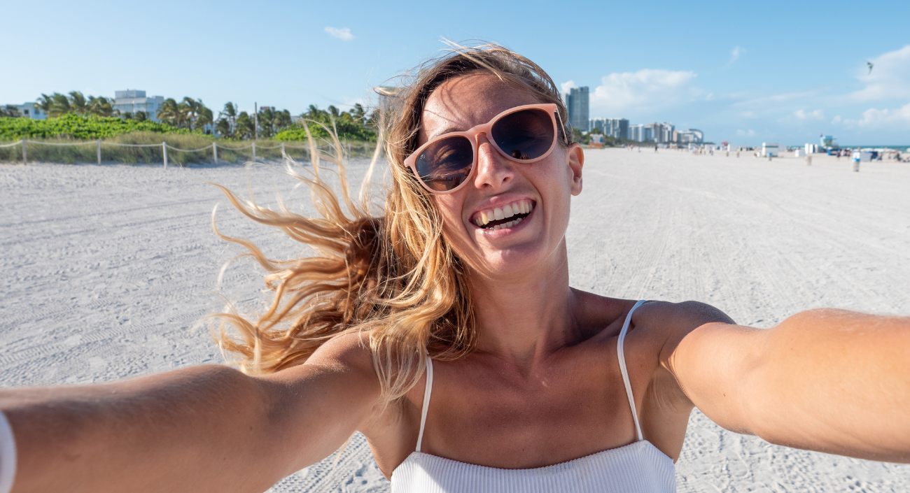 Woman taking a selfie on the beach