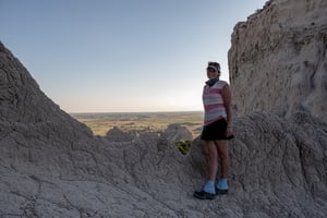 Woman standing in a rocky scenery