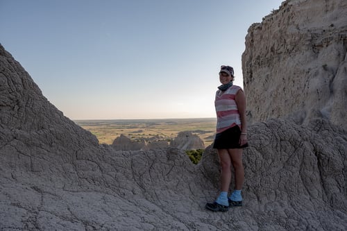 Woman standing in a rocky scenery