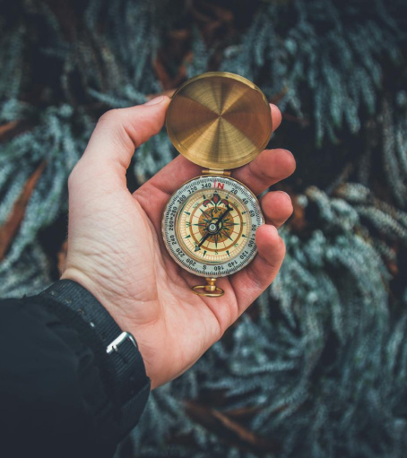 Compass being held in hand