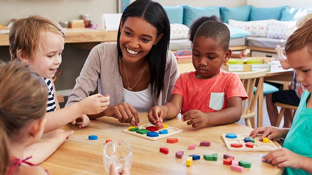 Teacher working with students