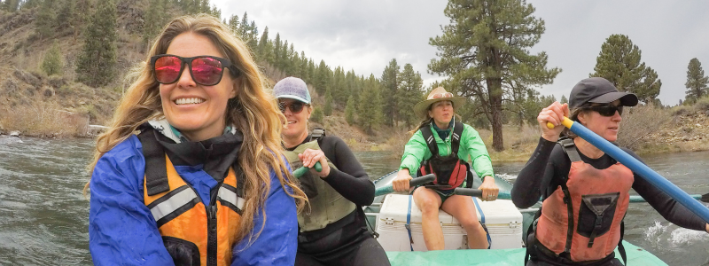Group of friends white-water rafting