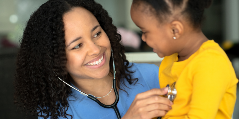 Nurse working with a child using a stethoscope