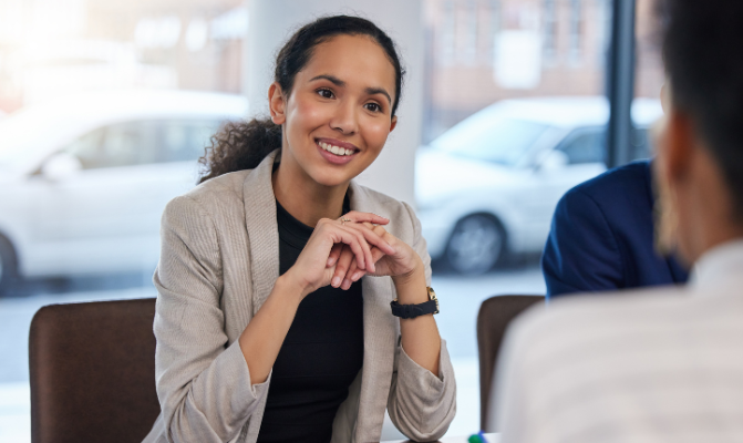 Recruiter sitting at a desk speaking to someone