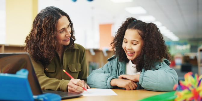 Teacher helping a student with work