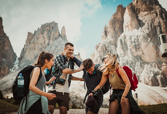 Group of friends hiking in rocky mountains